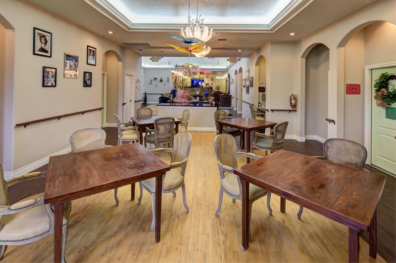 A beautifully designed dining area with elegant furniture and warm lighting.