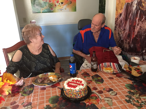 A joyful birthday celebration with cake and laughter shared between friends.
