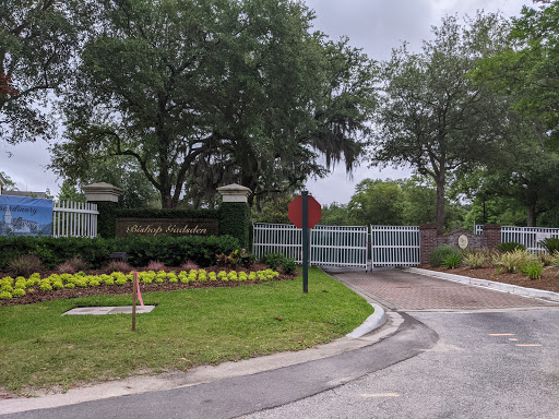 Entrance to a beautifully landscaped gated community.
