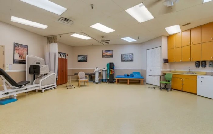 A clean and well-equipped medical treatment room in a healthcare facility.