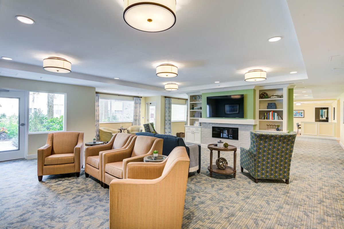 Spacious living room with comfortable seating, a fireplace, and a television.