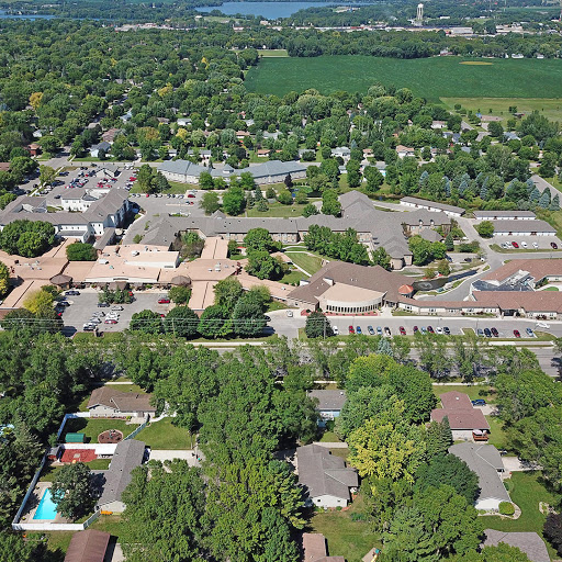 Aerial view of a suburban community showcasing residential areas and lush greenery.