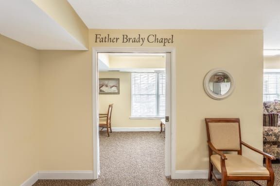 Entrance to Father Brady Chapel with visible interior furniture and decor.