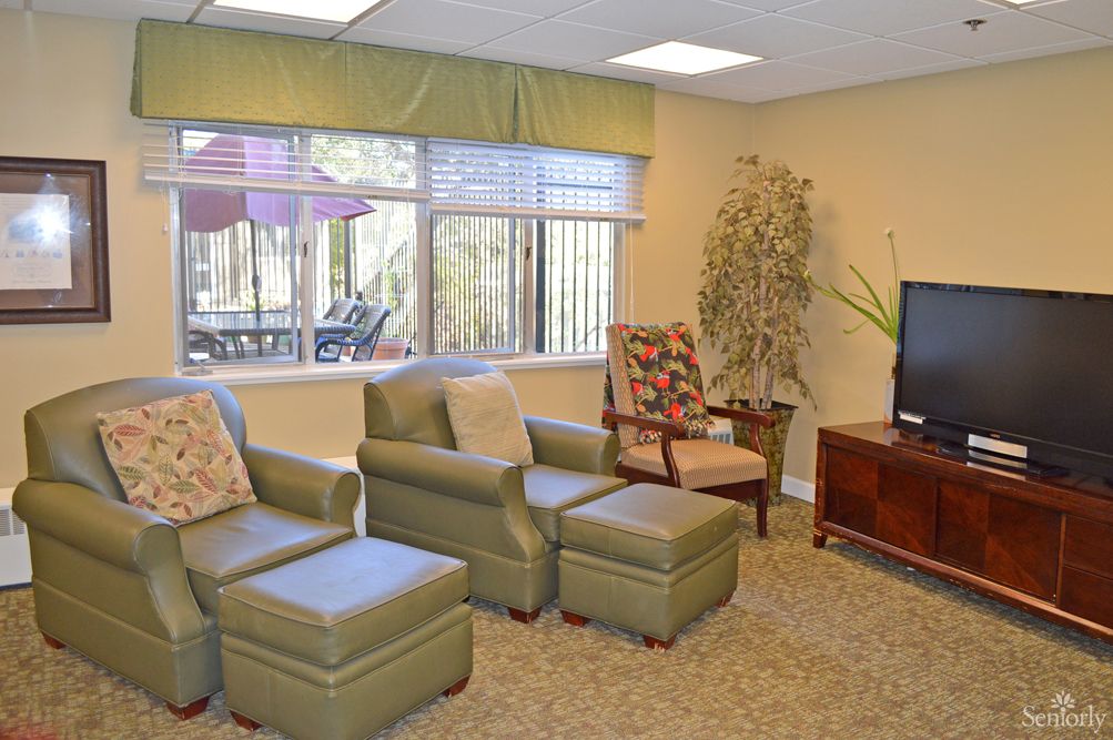A cozy living room with comfortable seating and a television.
