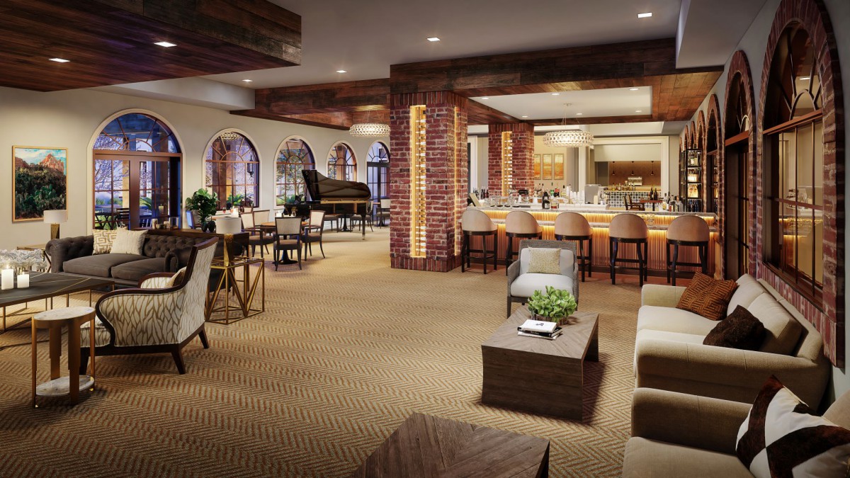 A spacious and elegantly designed lounge with a bar, comfortable seating, and a grand piano.