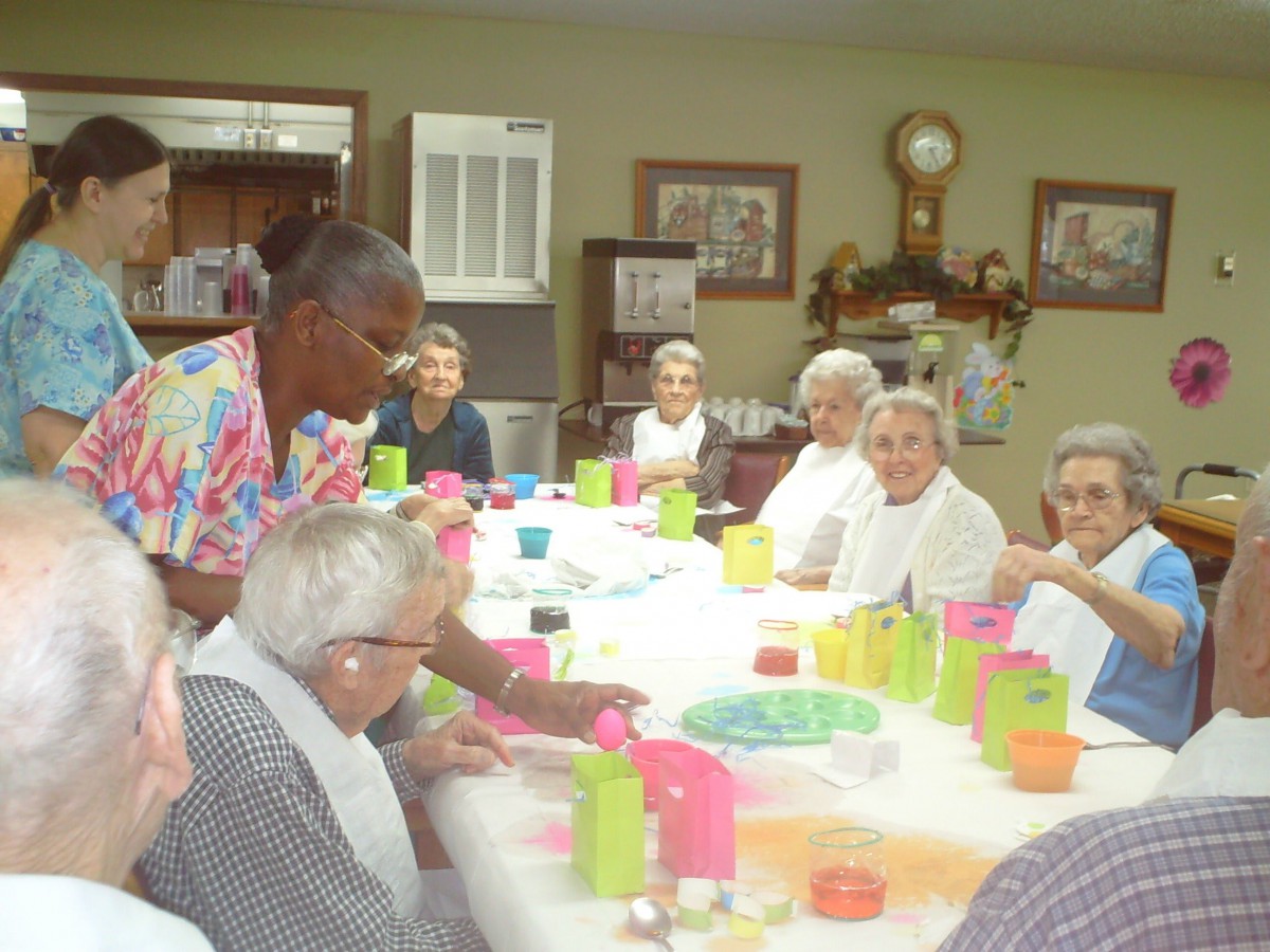 A group of seniors engaged in a social activity at a community center.