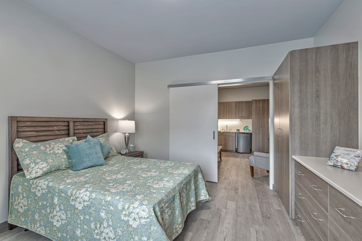 A modern bedroom with a comfortable bed and stylish decor.
