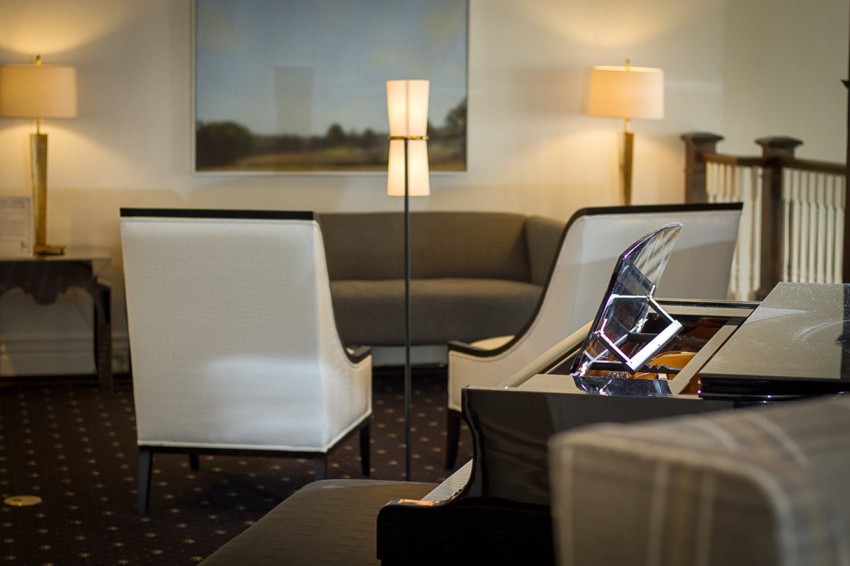 A modern lounge area with comfortable seating and contemporary lighting.