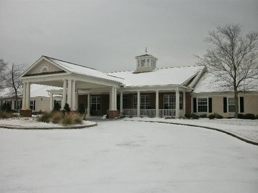 A charming residential building adorned with a fresh layer of snow during winter.