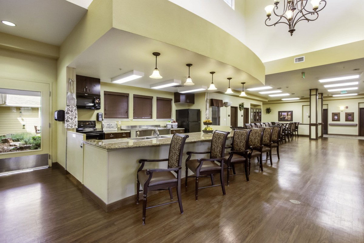A modern kitchen interior with a spacious countertop and seating area.