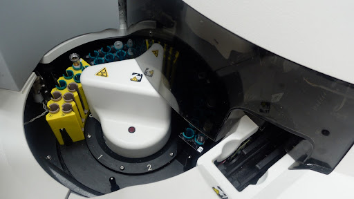Close-up view of a complex medical device, highlighting its intricate mechanical components.