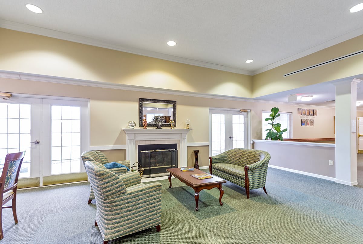 A cozy living room featuring elegant furniture and a fireplace.