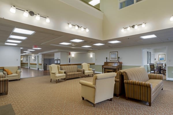 Spacious lobby area with comfortable seating and elegant lighting.