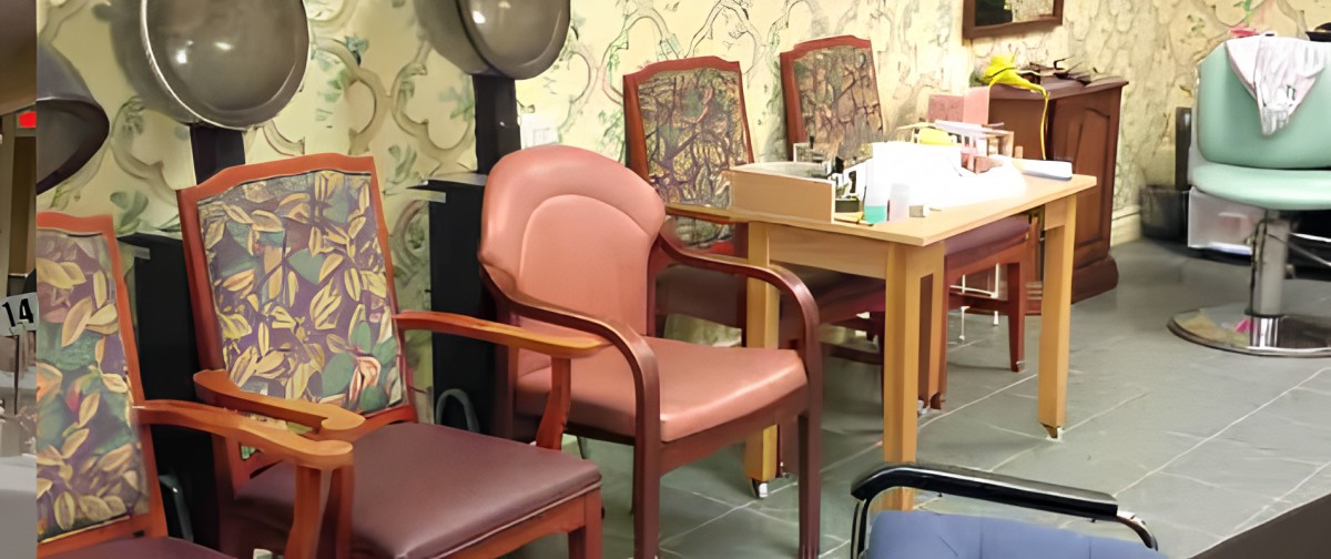 A cozy salon waiting area featuring a variety of comfortable chairs.