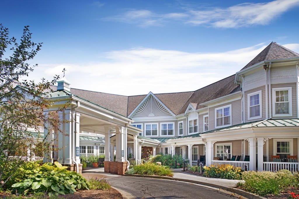 A picturesque view of a residential building with a welcoming entrance and well-maintained garden.
