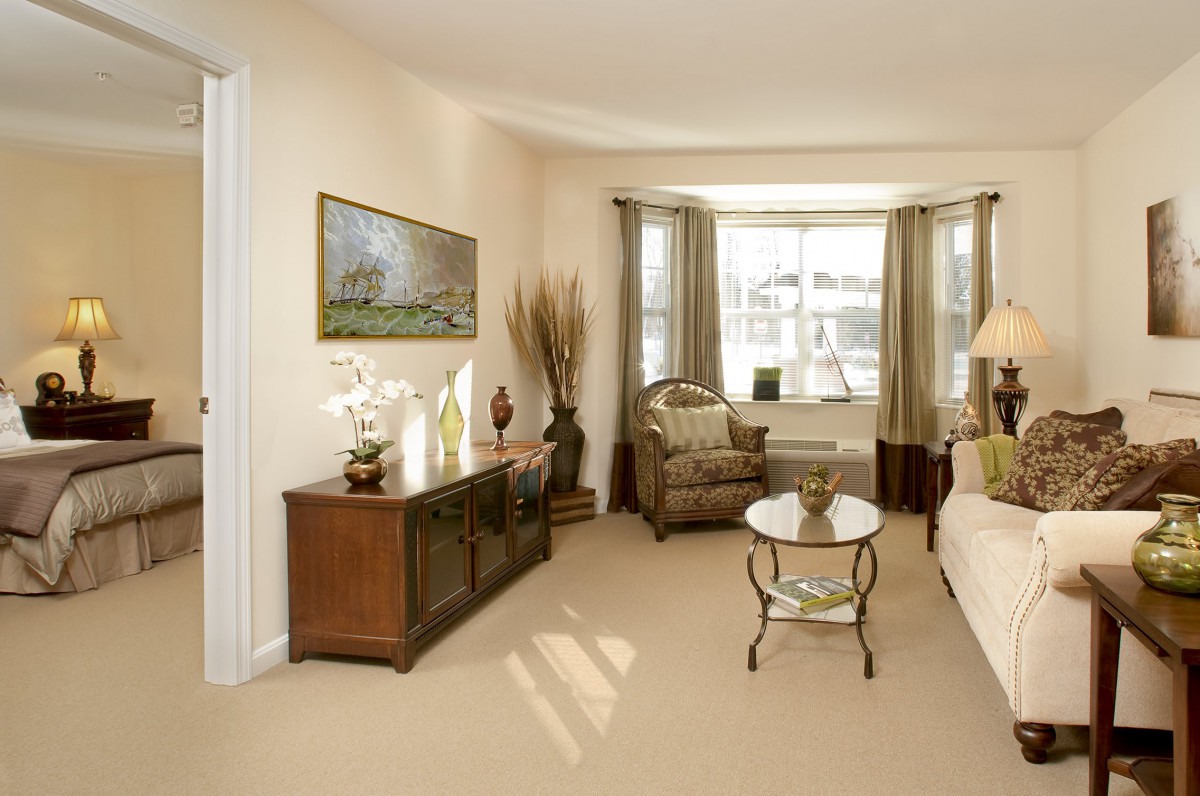 A well-lit living room with elegant furniture and decor.