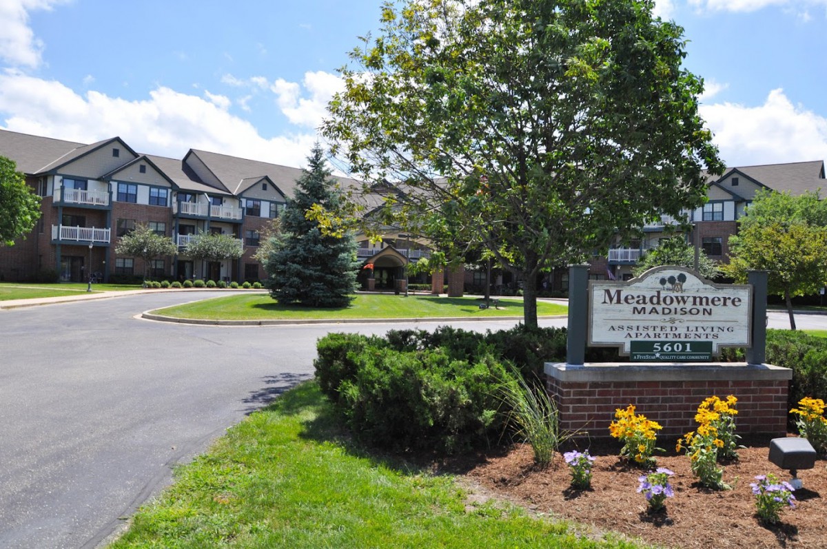 A well-maintained senior living community with neatly landscaped grounds and a welcoming entrance.