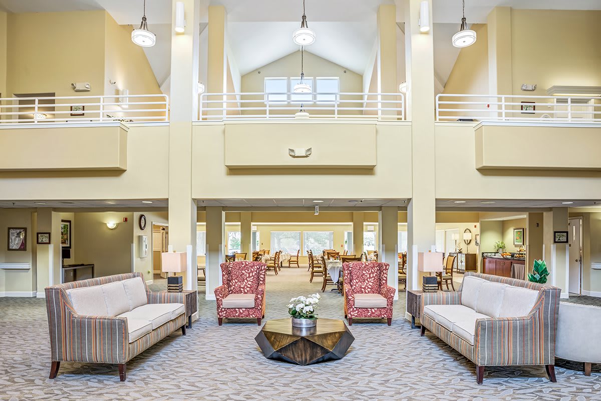 Spacious and well-lit lobby with elegant furniture arrangement.