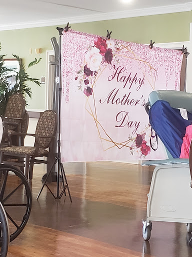 A decorative backdrop celebrating Mother's Day, adorned with flowers and a warm greeting.