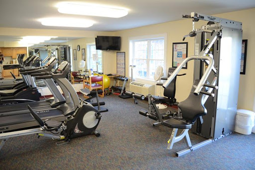 A well-equipped indoor gym featuring various exercise machines.
