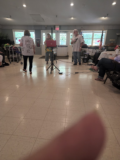 A musical performance taking place with an audience in attendance.
