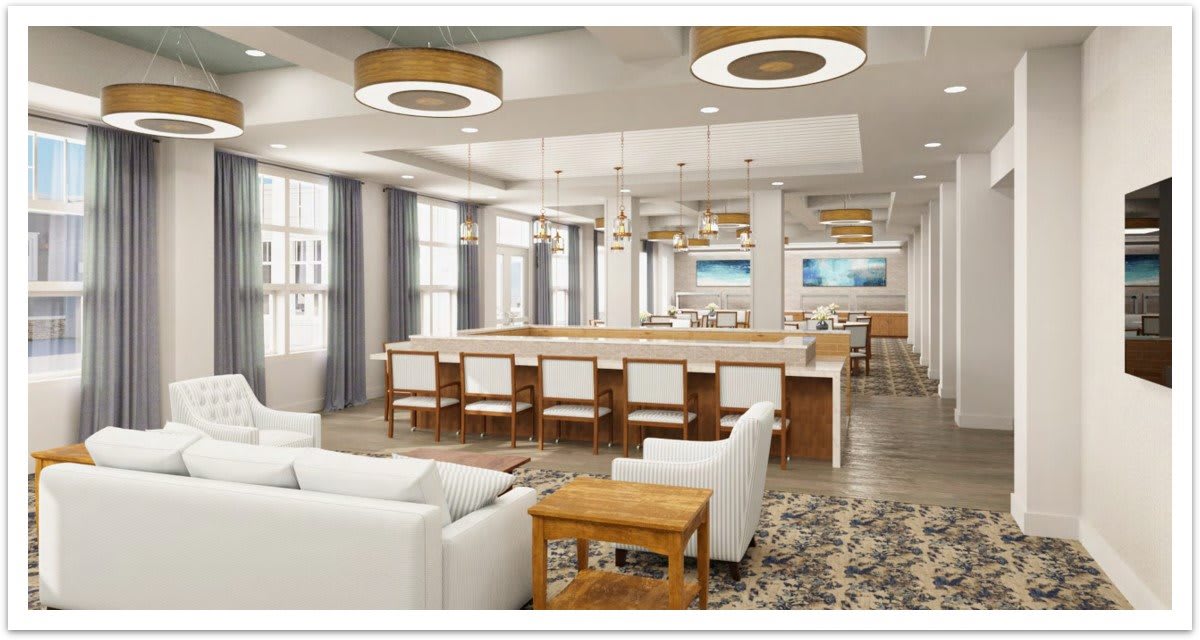 A modern open-concept living area featuring a large kitchen island and stylish lighting.