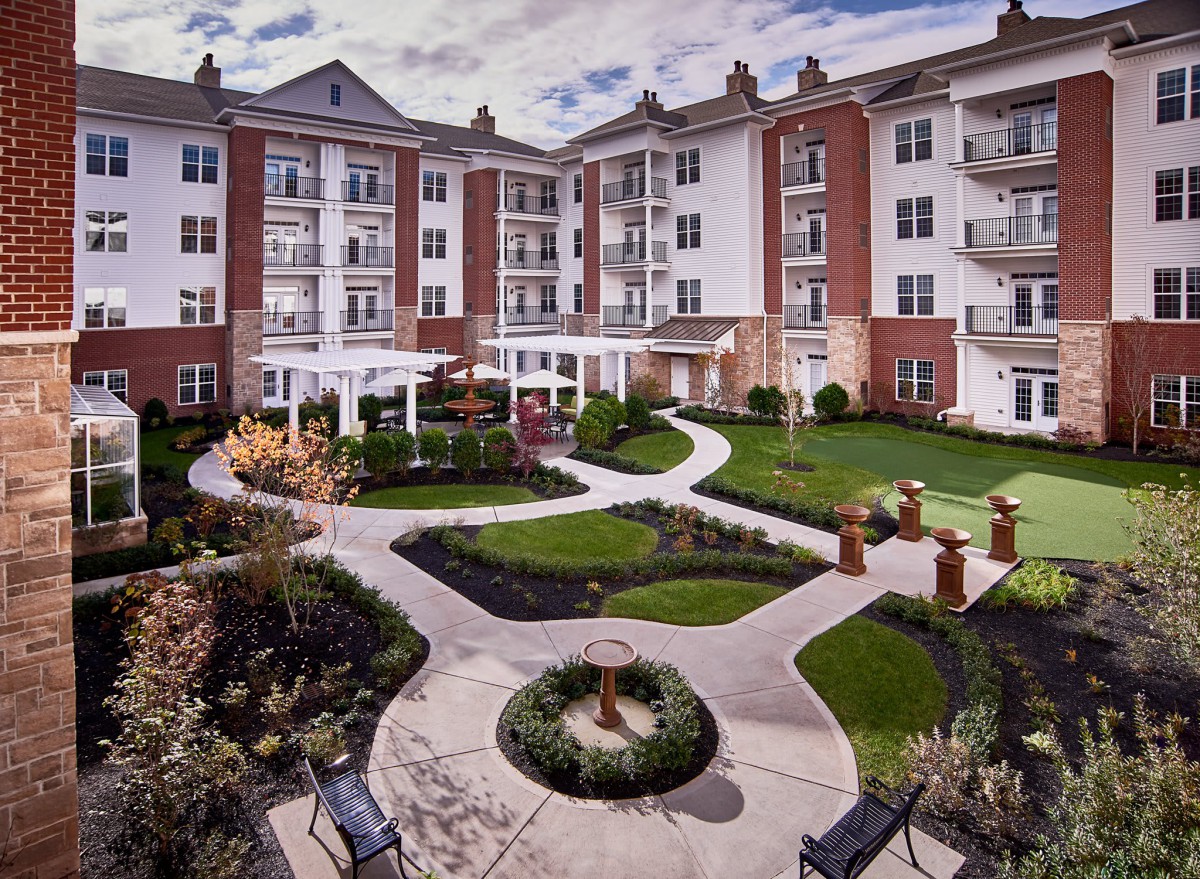 A beautifully landscaped courtyard in a residential apartment complex.