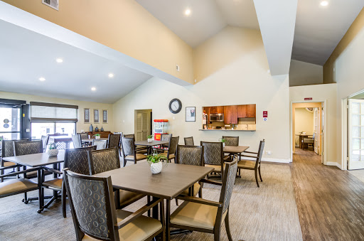 A spacious and inviting dining area with modern furniture, perfect for community gatherings.