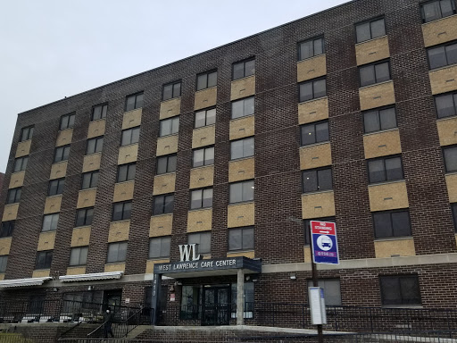 Facade of a hotel building featuring multiple windows and a prominent entrance.