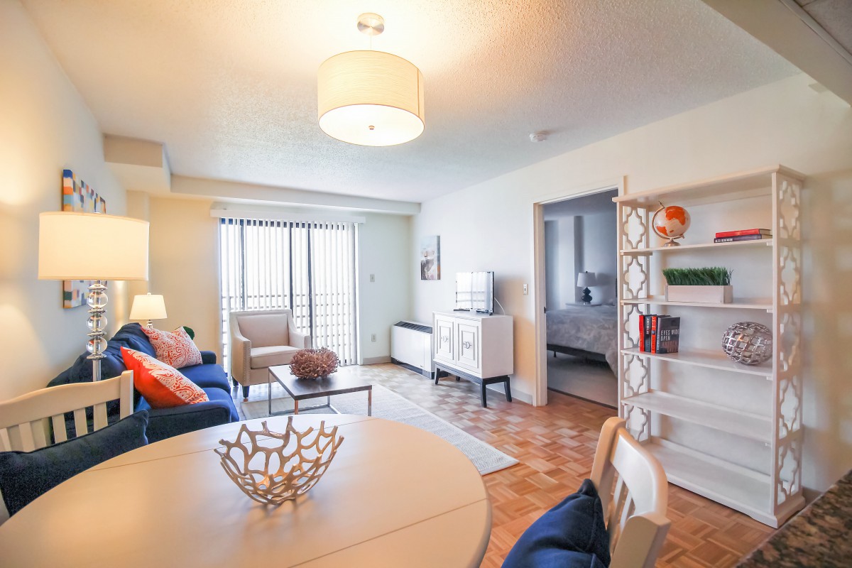 A modern and cozy living room with bright decor and comfortable seating.
