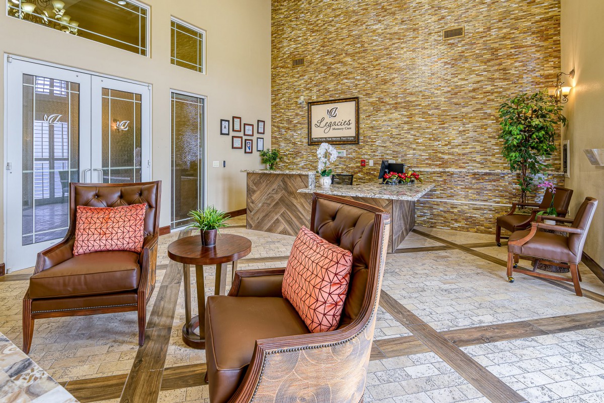 A welcoming lobby area featuring comfortable chairs, a reception desk, and stylish decor.
