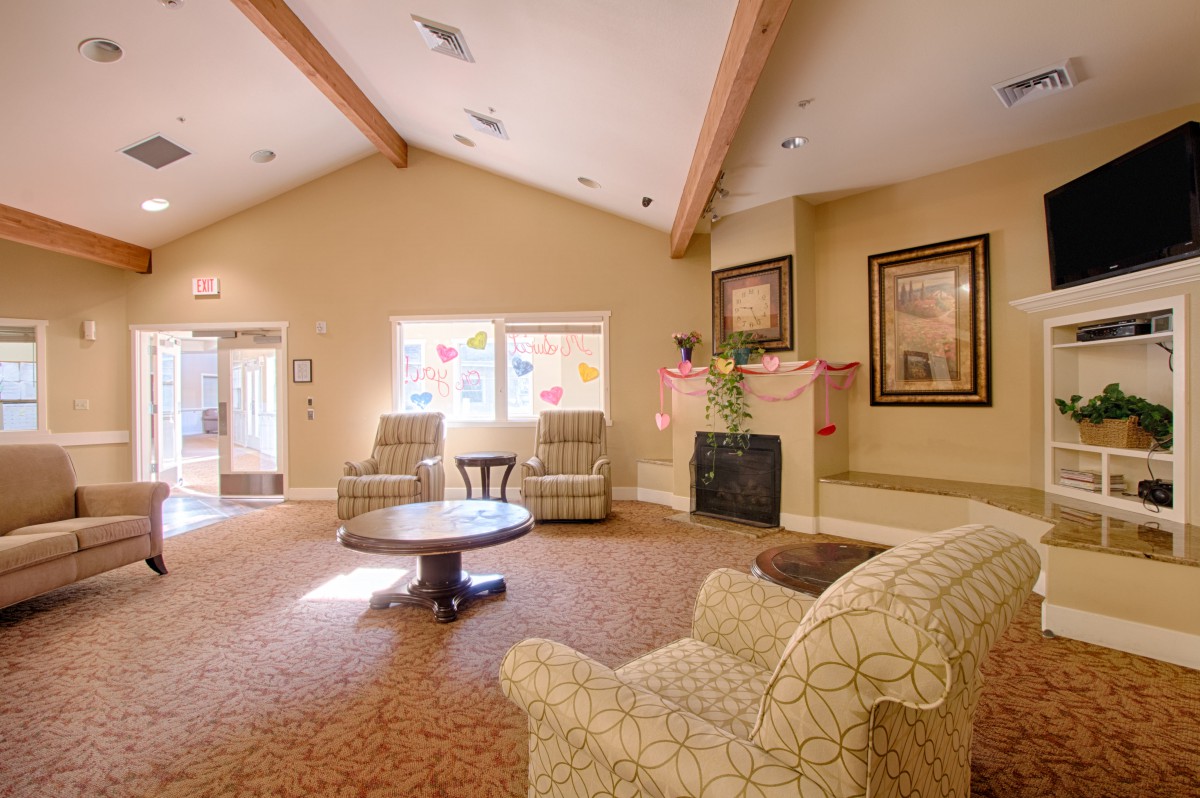 Cozy living room with comfortable seating and a fireplace.