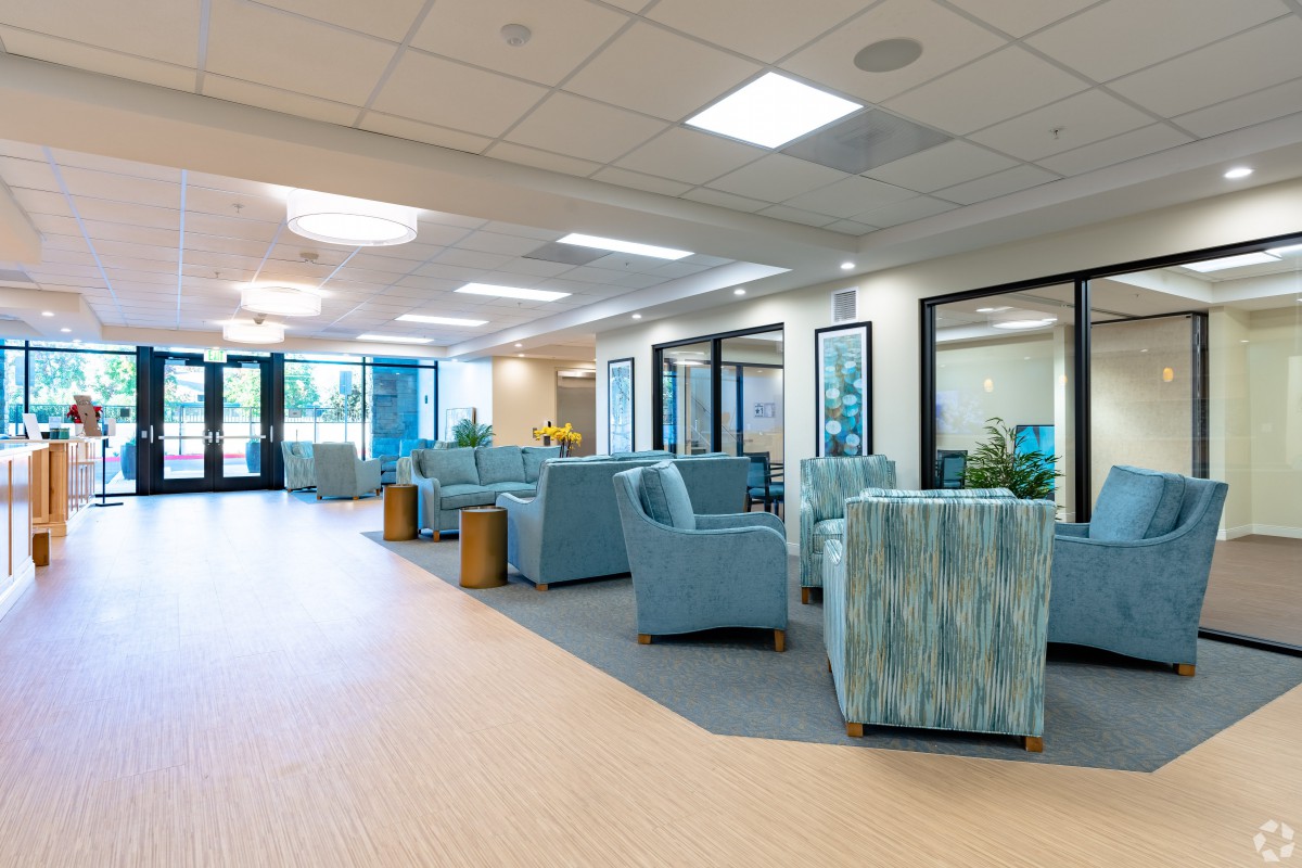A modern and well-lit waiting area with comfortable seating arrangements.