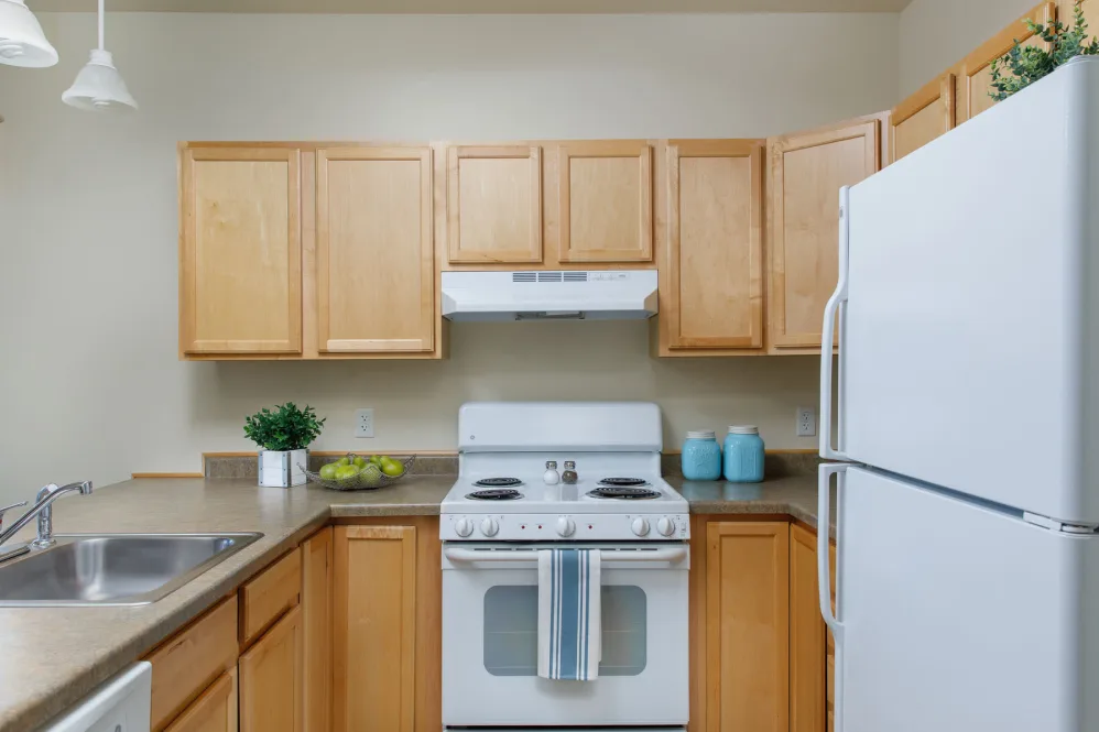A well-organized kitchen with wooden cabinets and modern appliances.