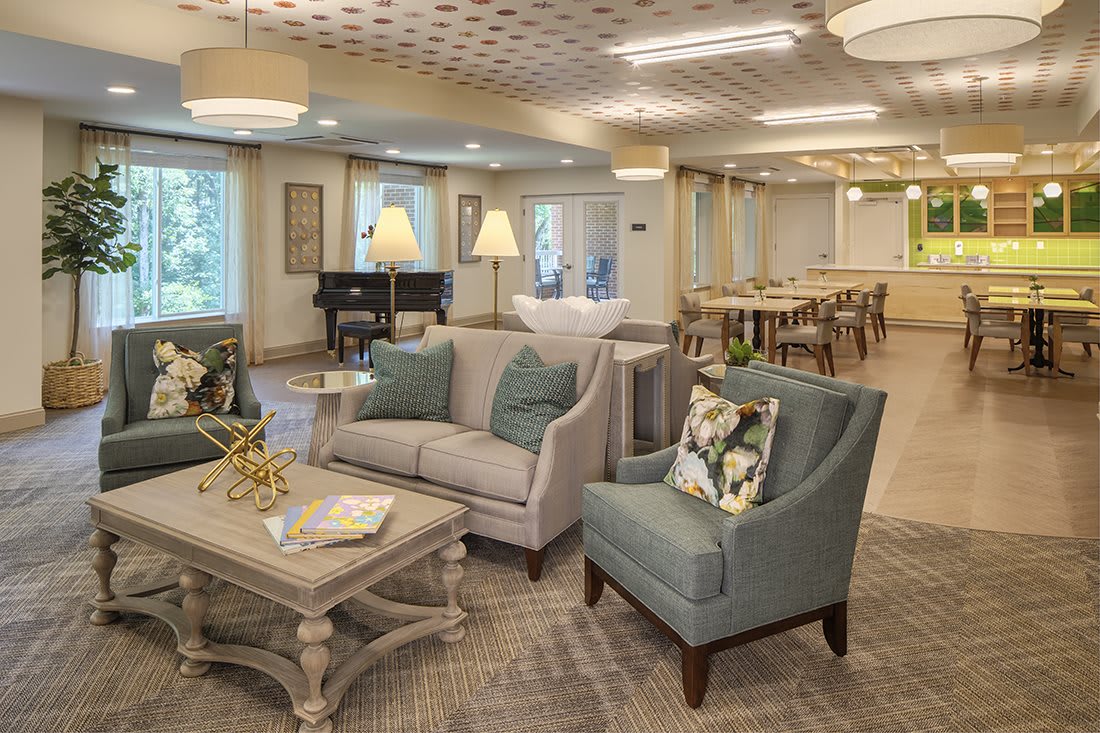 A cozy and elegant living room with comfortable seating and soft lighting.