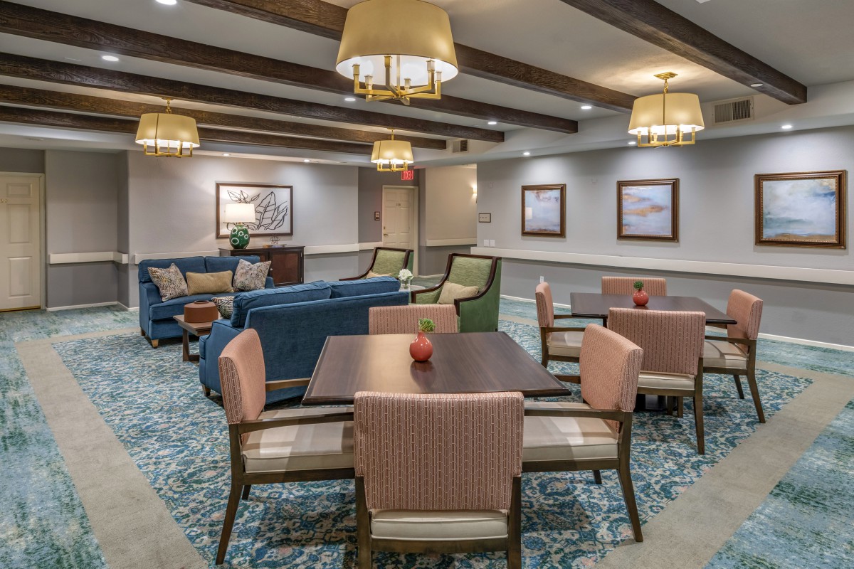 A cozy lounge area with comfortable seating and warm lighting.