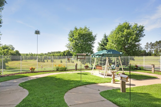 A serene outdoor park featuring a playground and lush green spaces, perfect for recreational activities.