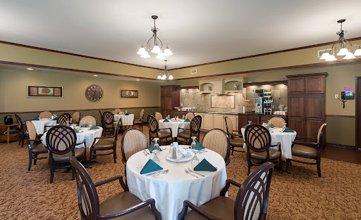 An elegant dining room setup featuring round tables and tasteful decor.