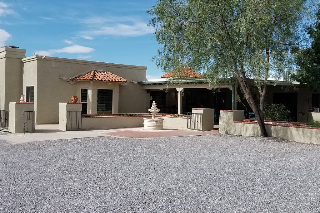 A desert-style house with a courtyard and central fountain.