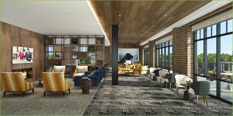 A modern lobby with stylish seating and large windows, featuring a sophisticated interior design.