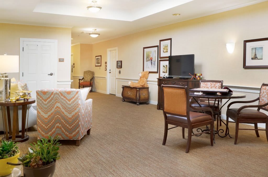 A cozy living area with comfortable seating, a television, and tasteful decor.