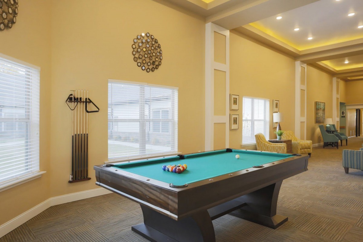 A well-designed game room featuring a pool table ready for play.