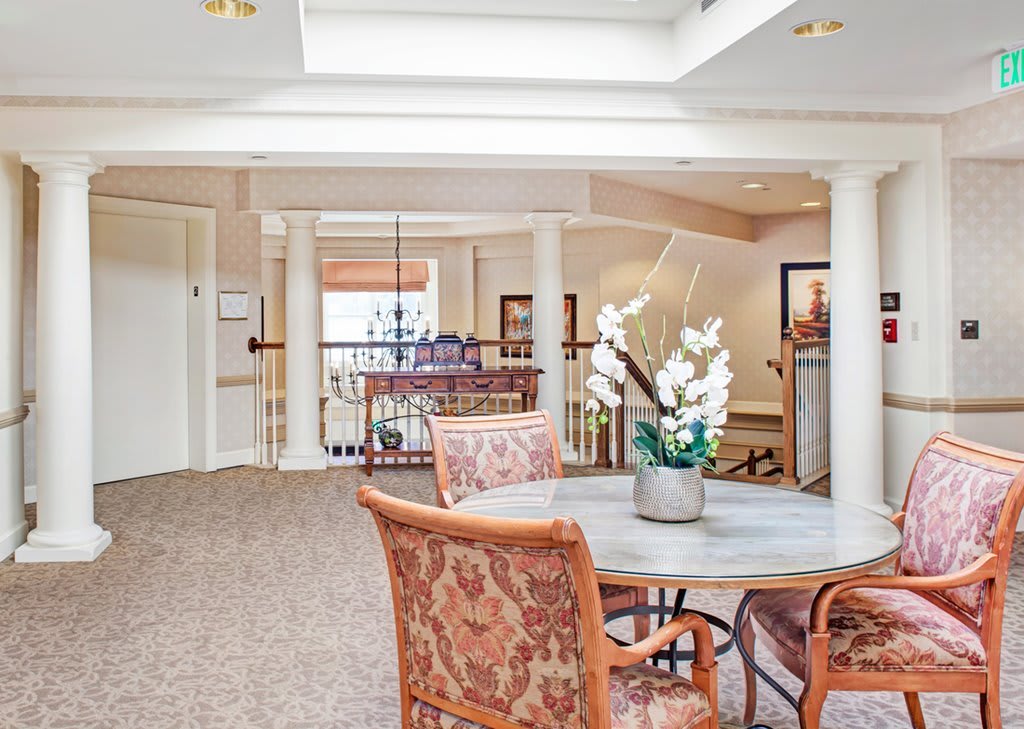 A well-lit lobby area with elegant furniture and decor.