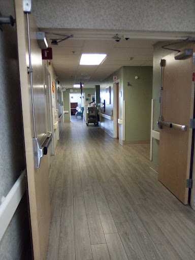 A view of a hospital corridor, showcasing the layout and design of the facility.