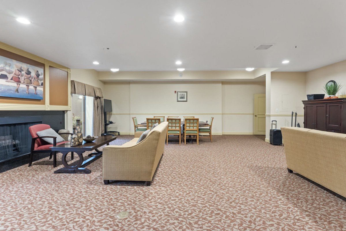 Spacious living area with comfortable seating and a dining table.