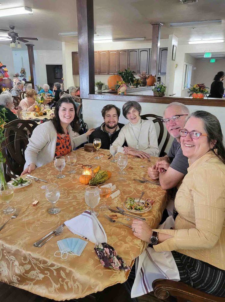 A group of people enjoying a meal together at a restaurant.