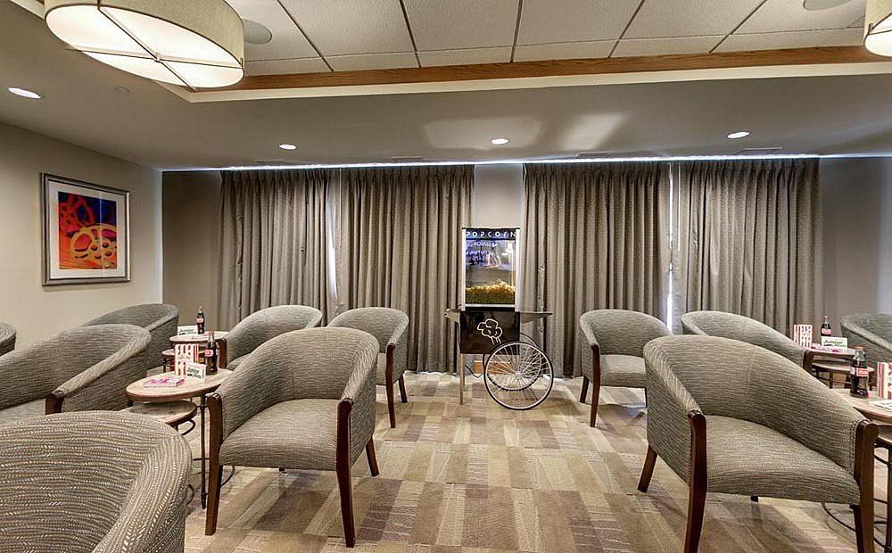 A well-arranged meeting room with comfortable chairs and elegant interior decor.