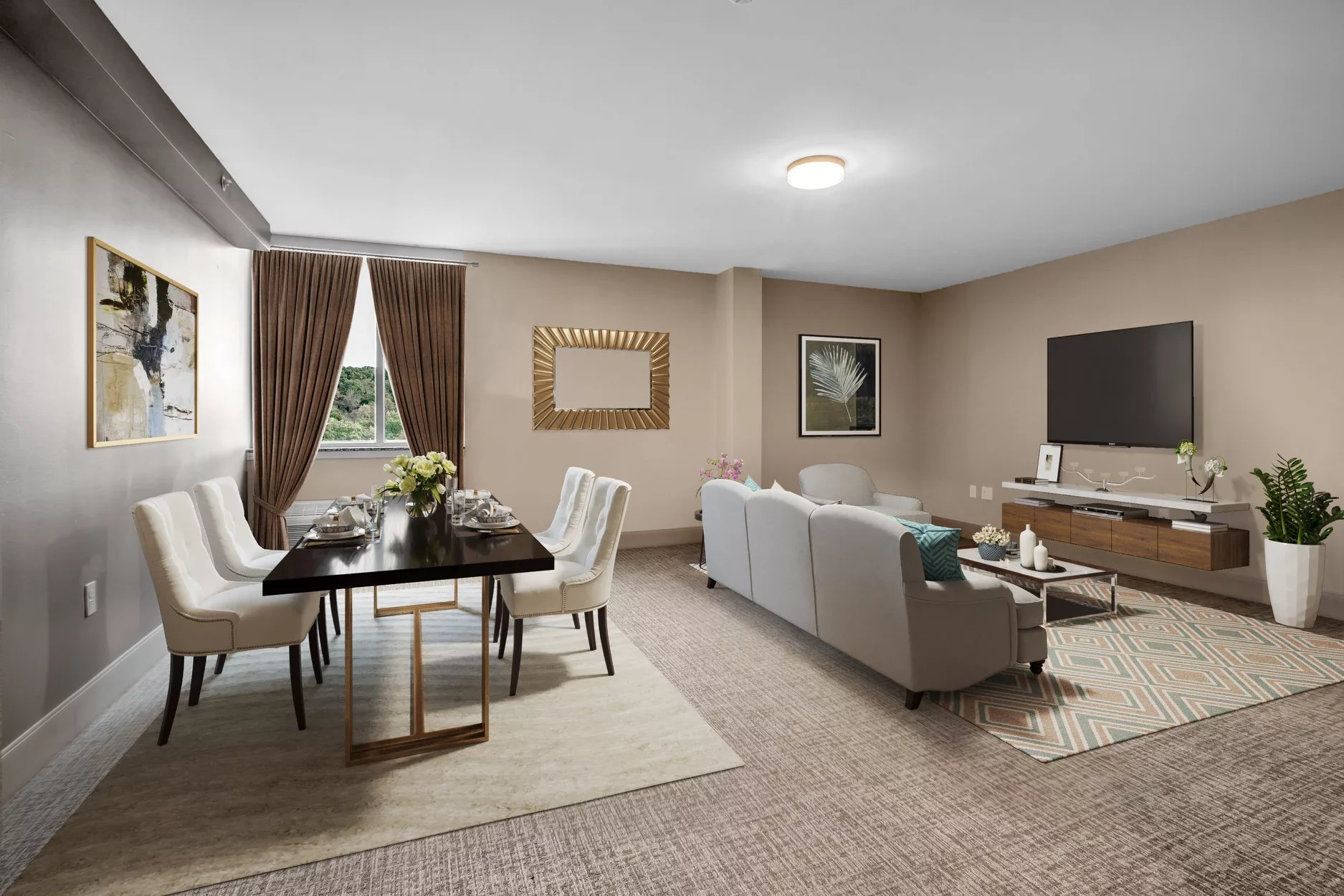 A modern living room with an adjoining dining area, featuring a comfortable sofa, dining table with chairs, and tasteful decor.