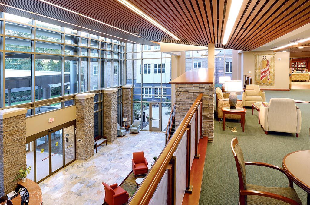 A modern lobby interior with comfortable seating and large windows.