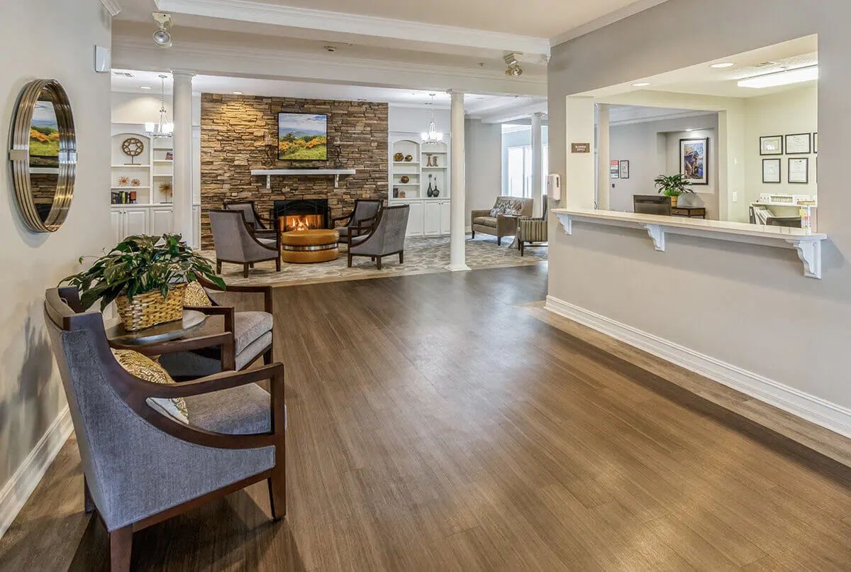 A spacious and inviting lobby area featuring comfortable seating and a fireplace.